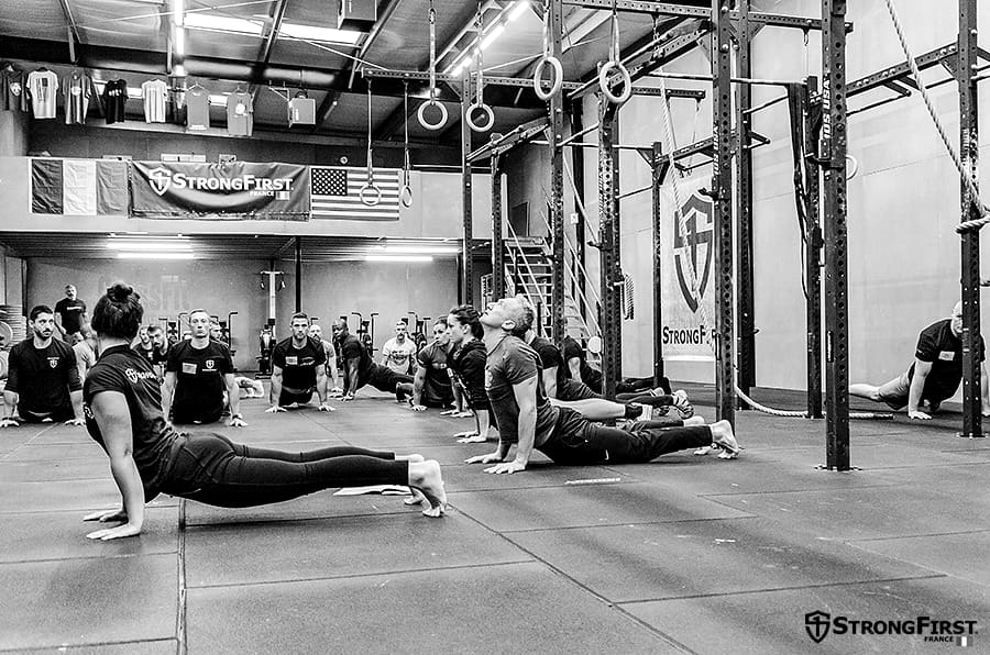 A group class working through a movement drill together